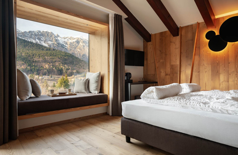 Stanza da letto della Suite Alpino-Contemporanea Eden